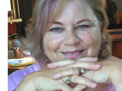 Portrait of Rev Catherine Alana Frosi, a planetary healer, smiling warmly.