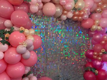 Sequin walls and balloons 
Our sequin walls come in iridescent and gold, team them up with a balloon
