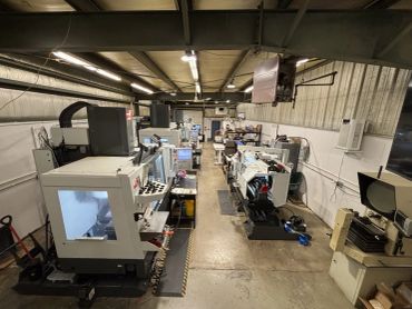 Workshop with CNC machines and equipment.