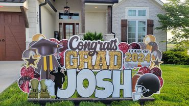 Custom graduation yard sign display in Kansas City front yard with senior name and class year