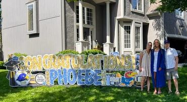 Custom grad yard card in Kansas City with school colors and personalized message