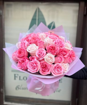 Vibrant hot pink rose bouquet with premium spray roses