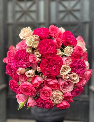 Vibrant hot pink rose bouquet with premium spray roses