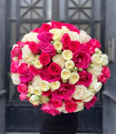 Vibrant hot pink rose bouquet with premium spray roses