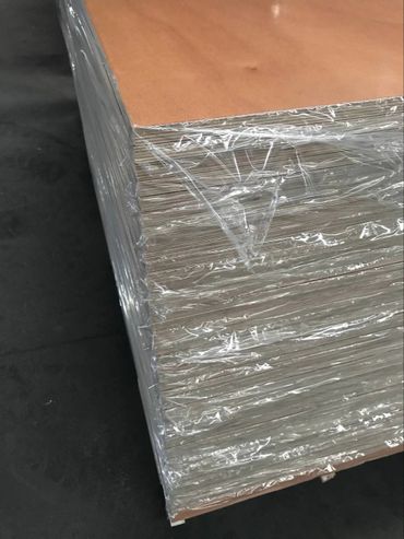 Sheets of varnished plywood