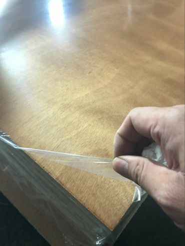 Protective cover on varnished plywood