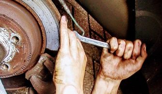 Pair-a-Dice Trike staff working on brakes