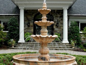 Traditional, elegant Courtyard Fountain spraying water. Located in Newport Beach, California.