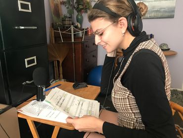 Jessica Arcura is recording Will's sister, Joan, in Anne Hathaway's song, in Pam's office.