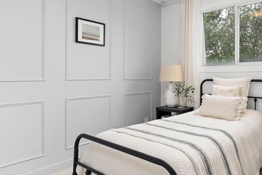 Sherman Williams Upward trimmed guest room wall.