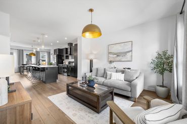Open Concept Contemporary Living with Urban Barn furnishings and Crate & Barrel Lighting.
