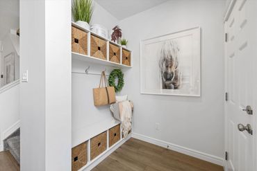 Entry way drop zone with hooks and cubbies.