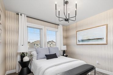 Create impact with Magnolia Home wallpaper and contemporary guest room decor.