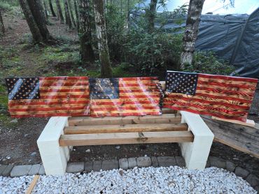 Wooden American flags displayed outdoors.