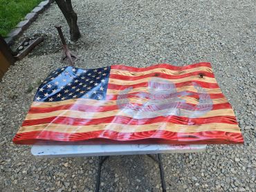 Wooden bench painted like the American flag.