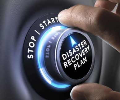 Hand turning a knob labeled 'Disaster Recovery Plan' with stop and start options.