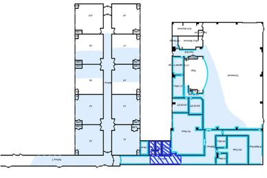 Blueprint of a building with labeled rooms and corridors.