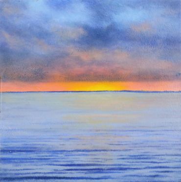 Sunset on water with purple tint, orange horizon
