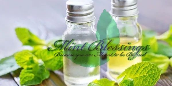 Two glass bottles surrounded by leaves