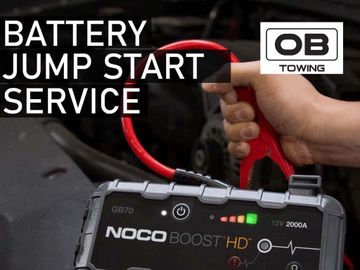 jump start boosting car battery jumpstart service, towing , flatbed tow truck roadside assistance 