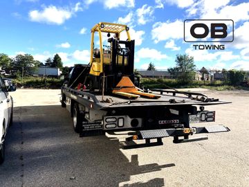 forklift towing service, bobcat towing flatbed towtruck sissier lift equipment towing caa flat bed