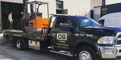forklift towing flatbed equipment towing tow truck around stouffville roadside assistance near me