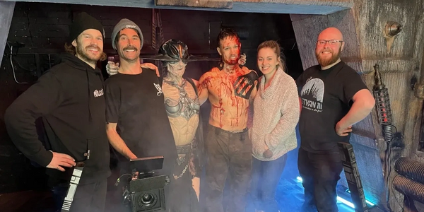 A group of people standing next to each other on a filmset