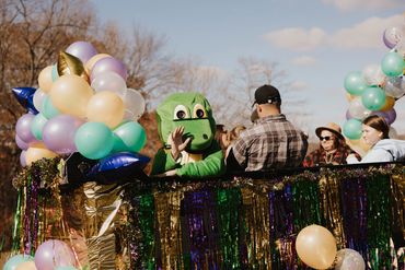 The Champion Life Church Cajun Gras gator waving from a hay ride