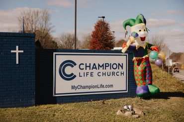 The Cajun Gras Jester by Champion Life Church sign