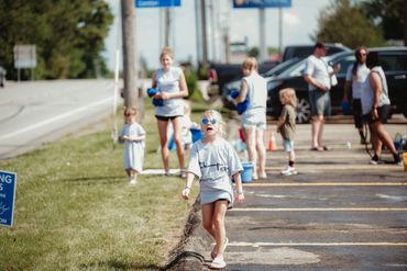 A group of Champion Life Church volunteers at a car wash in a parking lot in Chippewa, PA.