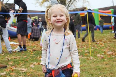 A candid of a little girl at Champion Life Church's fall Cajun Gras event.