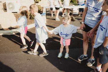 A group of Champion Life Church youth holding hands.