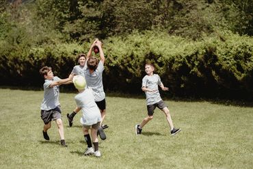 A group of Champion Life Church teens playing touch football.