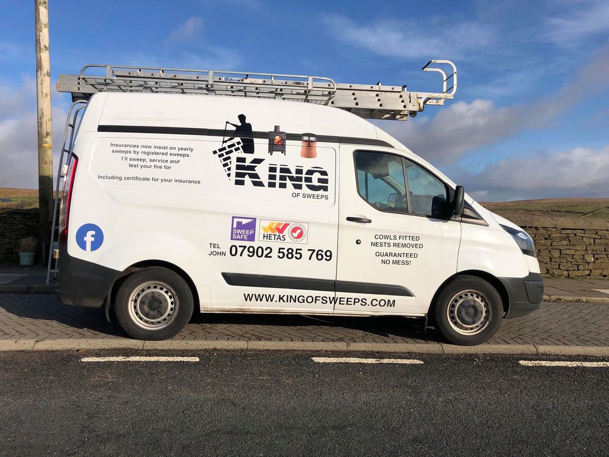 King of Sweeps Van parked on road