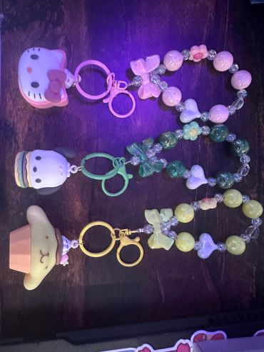 Three colorful character keychains with beaded bracelet attachments.