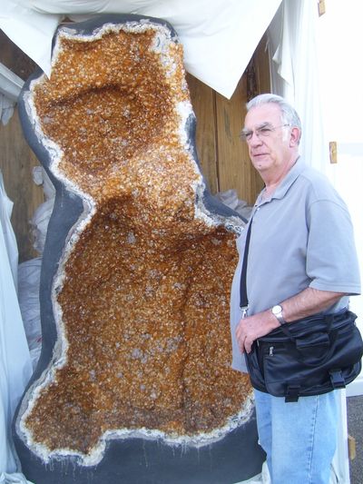 My dad, Richard Weiland, standing next to a large piece of citrine in Tucson, AZ