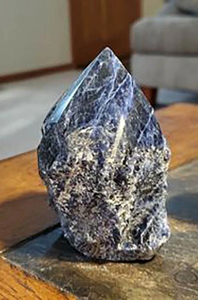 Sodalite point, rough on the bottom, polished on the top
