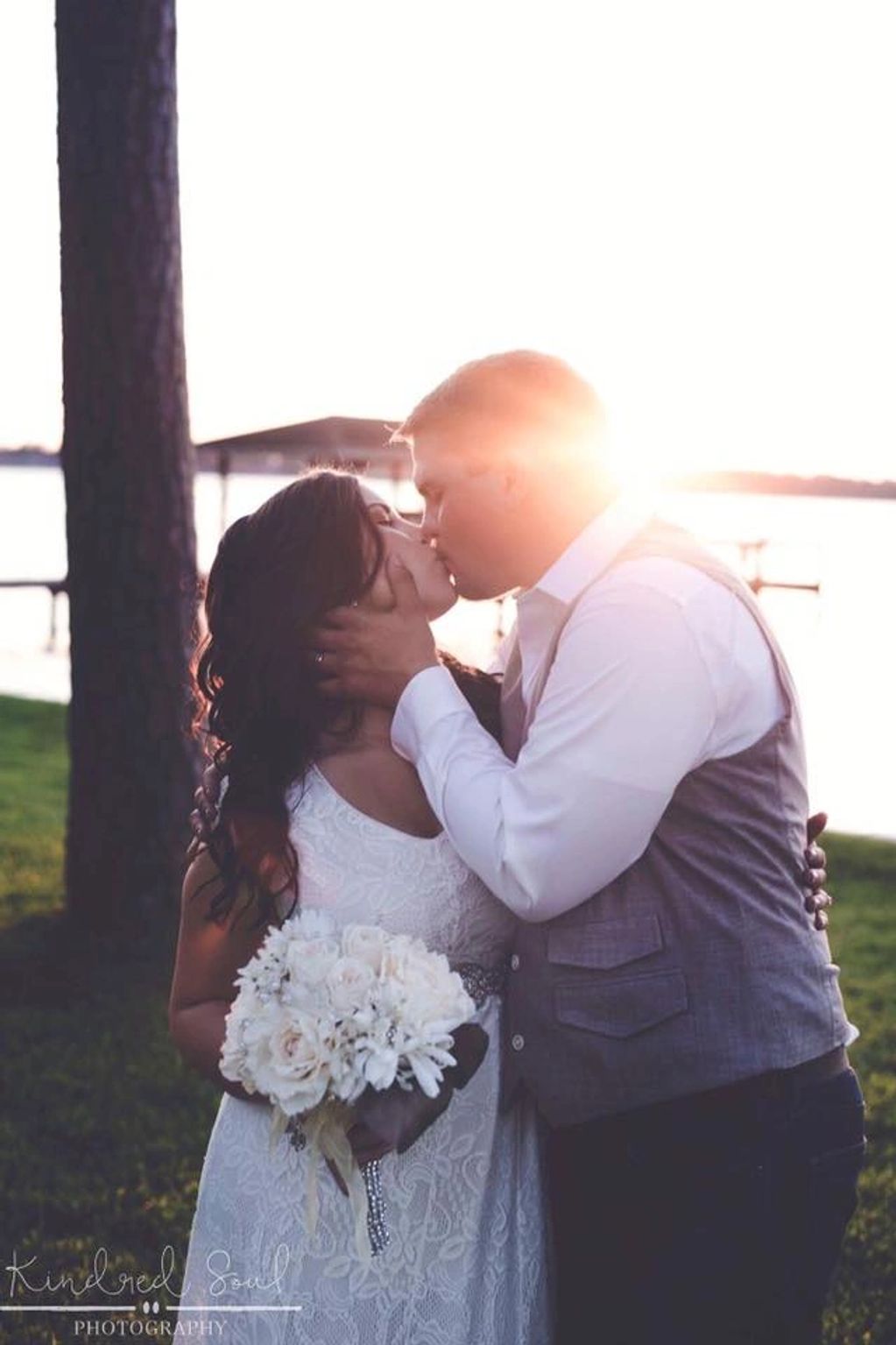 A married couple sharing a kiss after the service from our wedding officiant in Houston, TX