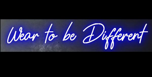 Neon sign glowing with the phrase 'Wear to be Different' in bright blue.