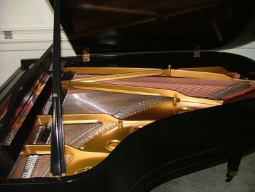 The inside of a Restored vintage piano