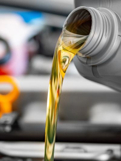 Motor oil being poured from a container.