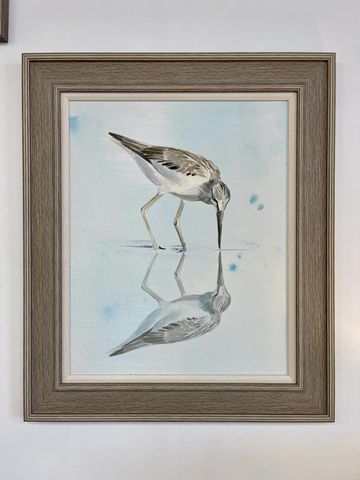 Painting of a bird looking at its reflection in water.