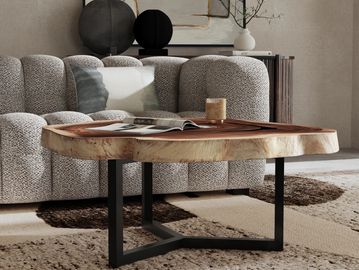 Modern living room with a textured sofa and wooden coffee table.