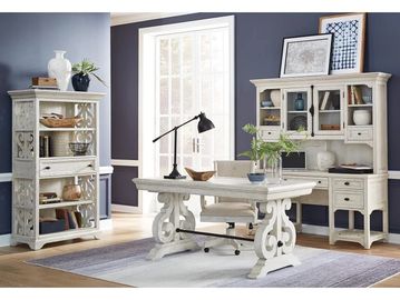 Bright home office with white vintage-style furniture and blue walls.