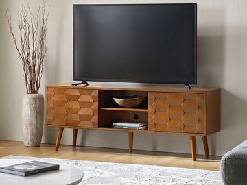 Modern wooden TV console with geometric pattern and minimalist decor.