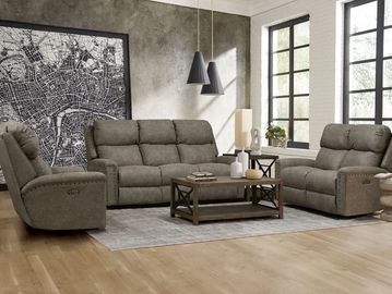 Modern living room with cozy gray sofas and a wooden coffee table on a light rug.