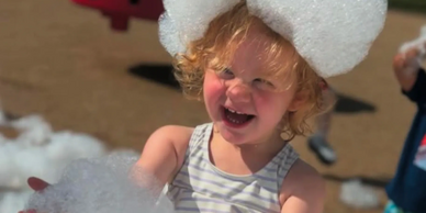 Kids experiencing a foam party for the first time with excitement and laughter