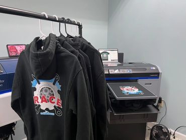 custom t-shirts and hoodies for an educational institution.
