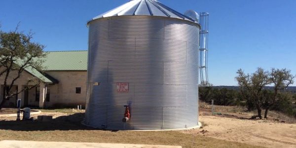 On The Move Water Boy bulk water delivery service to a water storage tank used for fire prevention.