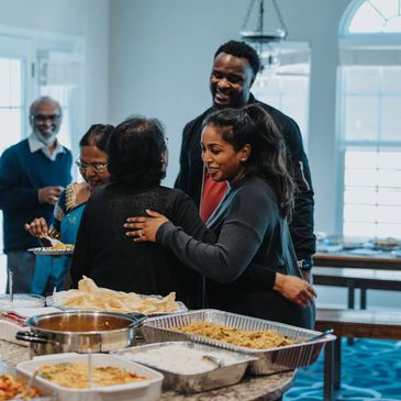 Family gathered in kitchen to celebrate